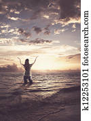 Woman praising in the ocean