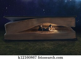 Woman reading inside a huge book Woman reading inside a huge book