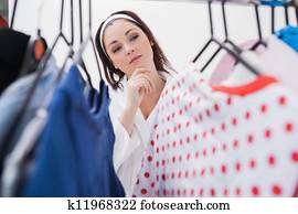 Woman selecting clothing