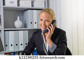 woman with phone in office