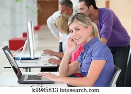 Young blond woman in business training