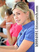 Young blond woman in business training