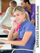 Young blond woman in business training