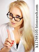 Young Executive Pointing Her Finger Up as a Sign of Warning Young Executive Pointing Her Finger Up as a Sign of Warning