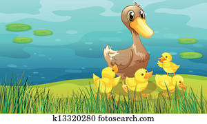 A duck and her ducklings at the riverbank