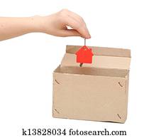 a woman's hand with the key of the new house