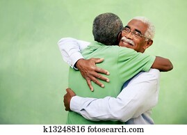 Active retired old men and leisure, two senior black brothers hugging outdoors