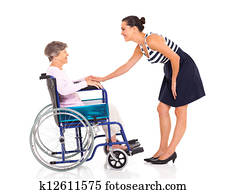 adult daughter talking to senior mother