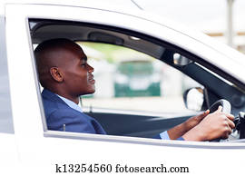 african businessman driving to work