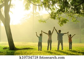 an asian family jumping in joy an asian family jumping in joy