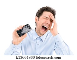 Angry man showing broken smartphone Angry man showing broken smartphone