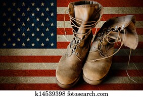Army boots on sandy flag background Army boots on sandy flag background