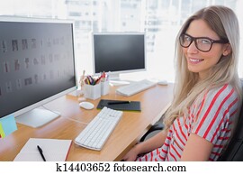 Attractive photo editor working on computer