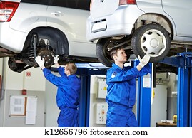 auto mechanic at car suspension repair work auto mechanic at car suspension repair work