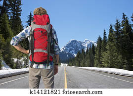 Backpacker on mountain road