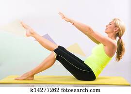 beautiful pilates instructor with yellow yoga mat beautiful pilates instructor with yellow yoga mat