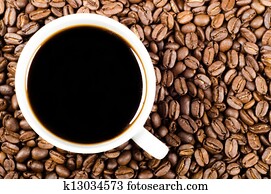 black filter coffee on coffee beans with copy space