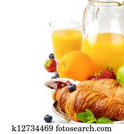 Breakfast with orange juice and fresh croissants Breakfast with orange juice and fresh croissants