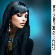 Brunette Girl. Healthy Long Hair and Holiday Makeup 