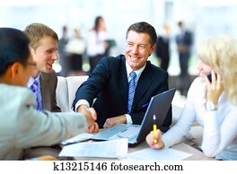 Business people shaking hands, finishing up a meeting Business people shaking hands, finishing up a meeting