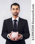 Businessman and His Piggy Bank Businessman and His Piggy Bank