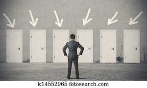 Businessman choosing the right door