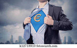 Businessman showing superman suit underneath shirt Businessman showing superman suit underneath shirt