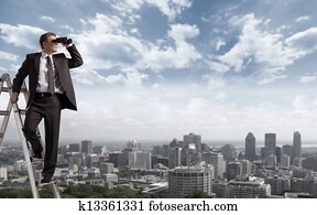 Businessman with binoculars.