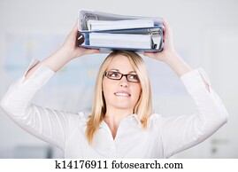 Businesswoman Carrying Two Binders On Head