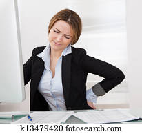 Businesswoman With Back Pain Businesswoman With Back Pain