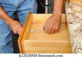 Cabinet Insataller Working on Drawer