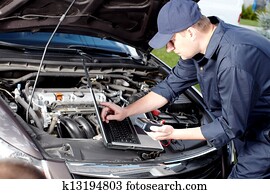 Car mechanic working in auto repair service. Car mechanic working in auto repair service.
