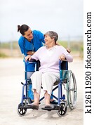 caregiver talking to senior woman caregiver talking to senior woman