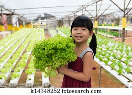 Child holding vegetable Child holding vegetable