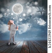 Child Playing with Moon and Stars at Night Child Playing with Moon and Stars at Night