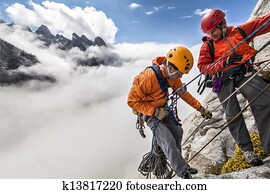 Climbing team rappelling. Climbing team rappelling.