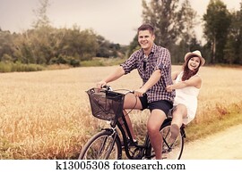 Couple have fun riding on bike Couple have fun riding on bike