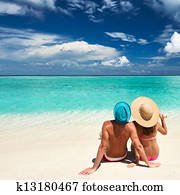 Couple on a beach at Maldives Couple on a beach at Maldives