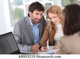 Couple signing property contract