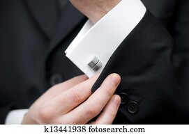 Cuff link, man is getting dressed