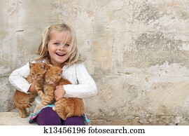 Cute girl holding kittens Cute girl holding kittens