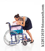 daughter comforting crying senior mother