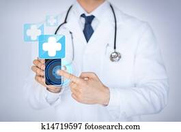 doctor holding smartphone with medical app