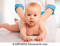 Doctor holds baby massage therapy