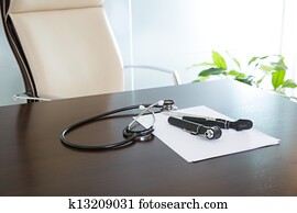 Doctor office table desk with stethoscope and otoscope