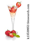 Drink with strawberries and mint in a champagne flute Drink with strawberries and mint in a champagne flute