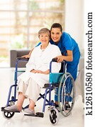 elderly woman and young caregiver elderly woman and young caregiver