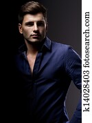 Elegant young handsome man. Studio fashion portrait.
