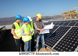 Engineering professional with group of students in training