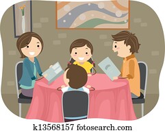 Family having a Dinner in a Restaurant Family having a Dinner in a Restaurant